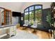 Well-appointed office space with a large window providing natural light and elegant decor at 5114 Brendlynn Dr, Suwanee, GA 30024