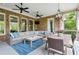 Enjoy a meal on this luxurious outdoor patio with a large table and comfortable seating at 5114 Brendlynn Dr, Suwanee, GA 30024