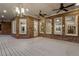 Spacious brick patio with white-painted wood flooring and ceiling fans offers ample outdoor entertaining space at 5114 Brendlynn Dr, Suwanee, GA 30024