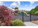 Outdoor playground featuring a slide, tower, and safety fence ensuring fun and secure recreation for children at 5114 Brendlynn Dr, Suwanee, GA 30024