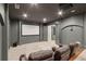Cozy theater room with a large screen, plush seating, and dimmable lights for movie nights at 5114 Brendlynn Dr, Suwanee, GA 30024