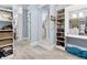 Walk-in closet with carpet flooring, custom shelving and storage, and a full length mirror at 5114 Brendlynn Dr, Suwanee, GA 30024
