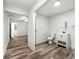 Bright bathroom featuring vinyl floors, white paint, toilet, vanity and doorway to other rooms at 132 Lamar Nw Ave, Atlanta, GA 30314