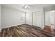 Cozy bedroom featuring vinyl floors, white walls, ceiling fan, closet and natural light at 132 Lamar Nw Ave, Atlanta, GA 30314