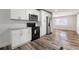Modern kitchen with white cabinetry, stainless steel appliances, and hardwood floors at 132 Lamar Nw Ave, Atlanta, GA 30314
