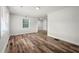 Bright and airy living room with vinyl floors, white paint, and natural light at 132 Lamar Nw Ave, Atlanta, GA 30314