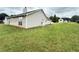 Spacious backyard offering ample green space with a concrete patio at 2658 Deann Dr, Ellenwood, GA 30294