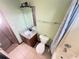 Bathroom featuring granite vanity, shower-tub combo, and tiled floors at 2658 Deann Dr, Ellenwood, GA 30294