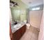 Cozy bathroom featuring a shower-tub combo and granite countertops at 2658 Deann Dr, Ellenwood, GA 30294