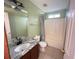 Cozy bathroom with a granite vanity, tile floors, and shower-tub combo at 2658 Deann Dr, Ellenwood, GA 30294