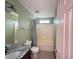 Bathroom featuring a tub-shower combo, toilet and vanity at 2658 Deann Dr, Ellenwood, GA 30294