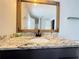 Bathroom featuring a granite countertop vanity and large mirror at 2658 Deann Dr, Ellenwood, GA 30294