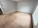 Large bedroom featuring neutral walls, carpet, and natural light at 2658 Deann Dr, Ellenwood, GA 30294