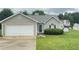 Inviting single-story house with a two-car garage and well-maintained front yard at 2658 Deann Dr, Ellenwood, GA 30294