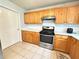 Kitchen with light wood cabinets, white subway tile and stainless steel appliances at 2658 Deann Dr, Ellenwood, GA 30294