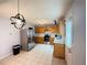 Bright kitchen with stainless steel appliances, ample cabinetry, and modern lighting at 2658 Deann Dr, Ellenwood, GA 30294