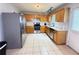 Spacious kitchen featuring stainless appliances, ample cabinetry, and tile flooring at 2658 Deann Dr, Ellenwood, GA 30294