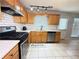 Modern kitchen equipped with stainless steel appliances and tiled floor at 2658 Deann Dr, Ellenwood, GA 30294