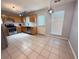 Well-lit kitchen features stainless appliances, wooden cabinets, and updated backsplash at 2658 Deann Dr, Ellenwood, GA 30294