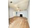 Open living room with ceiling fan, neutral paint, and access to multiple rooms at 2658 Deann Dr, Ellenwood, GA 30294