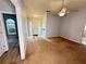Spacious living room leads to the front door and features neutral paint and carpet at 2658 Deann Dr, Ellenwood, GA 30294