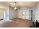 Spacious living room with carpet, ceiling fan, and views to other parts of the house at 2658 Deann Dr, Ellenwood, GA 30294