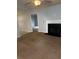 View of a fireplace, ceiling fan and doorway into another room at 2658 Deann Dr, Ellenwood, GA 30294