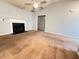 Cozy living room with vaulted ceilings, fireplace, and neutral carpet at 2658 Deann Dr, Ellenwood, GA 30294
