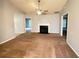 Bright living room featuring a ceiling fan, fireplace, and neutral walls at 2658 Deann Dr, Ellenwood, GA 30294