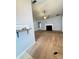 View of a fireplace, ceiling fan and doorway into another room at 2658 Deann Dr, Ellenwood, GA 30294