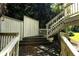 Multi-level back porch and stairs surrounded by lush foliage, creating a private outdoor space at 2831 Carolyn Se Dr, Smyrna, GA 30080