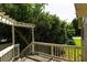 A charming back porch surrounded by lush trees, offering a serene outdoor retreat at 2831 Carolyn Se Dr, Smyrna, GA 30080
