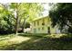 Large backyard with mature trees, wooden deck and an upper-level porch at 2831 Carolyn Se Dr, Smyrna, GA 30080
