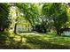 Overlooking the home's lush green backyard with a peek at an additional outbuilding at 2831 Carolyn Se Dr, Smyrna, GA 30080