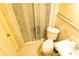 Bathroom featuring a toilet, sink, towel rack, and a glass shower enclosure at 2831 Carolyn Se Dr, Smyrna, GA 30080