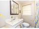 Bathroom including sink, toilet and mirror at 2831 Carolyn Se Dr, Smyrna, GA 30080