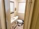 Bathroom with vanity, a mirror, toilet and window providing natural light at 2831 Carolyn Se Dr, Smyrna, GA 30080