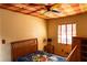 A bedroom with a patterned ceiling, a bed, and two windows at 2831 Carolyn Se Dr, Smyrna, GA 30080