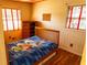 Sunlit bedroom with a patterned ceiling, hardwood floors, and two windows at 2831 Carolyn Se Dr, Smyrna, GA 30080