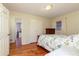 Comfortable bedroom with hardwood floors, neutral walls, and a view into another room at 2831 Carolyn Se Dr, Smyrna, GA 30080