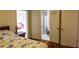 A cozy bedroom with hardwood floors featuring an ensuite bathroom and additional room with colorful furnishings at 2831 Carolyn Se Dr, Smyrna, GA 30080