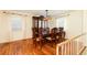 Dining room with hardwood floors, large china cabinet, traditional dining table set, and natural light at 2831 Carolyn Se Dr, Smyrna, GA 30080