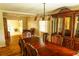 Dining room with hardwood flooring, a china cabinet, and views of the entryway and front room at 2831 Carolyn Se Dr, Smyrna, GA 30080