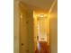 A hallway with hardwood floors, neutral walls, and a view into another room at 2831 Carolyn Se Dr, Smyrna, GA 30080