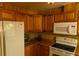 Kitchen includes wood paneling, white appliances, and matching light brown countertops at 2831 Carolyn Se Dr, Smyrna, GA 30080