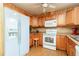 Cozy kitchen offering ample cabinet space, essential appliances, and a vintage aesthetic at 2831 Carolyn Se Dr, Smyrna, GA 30080