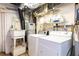 Laundry room includes washer, dryer, and laundry sink at 2831 Carolyn Se Dr, Smyrna, GA 30080