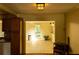 An open-concept design of the living room with a window and a view into another room with furniture at 2831 Carolyn Se Dr, Smyrna, GA 30080