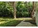 A view of the home's side yard showing the wooded area next to the yard at 2831 Carolyn Se Dr, Smyrna, GA 30080