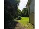 Adjacent to the home's side yard is a nice grassy area with surrounding woods at 2831 Carolyn Se Dr, Smyrna, GA 30080